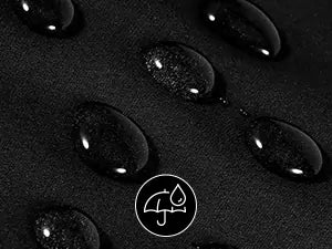 Close-up of water droplets on a black hair catcher for haircuts surface